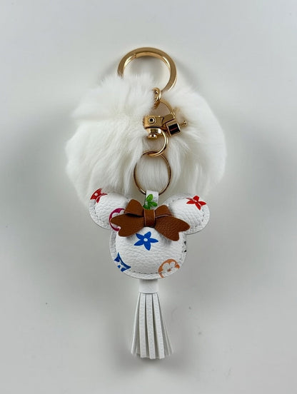 White fluffy pom-pom keyring with multicolour LV charm
