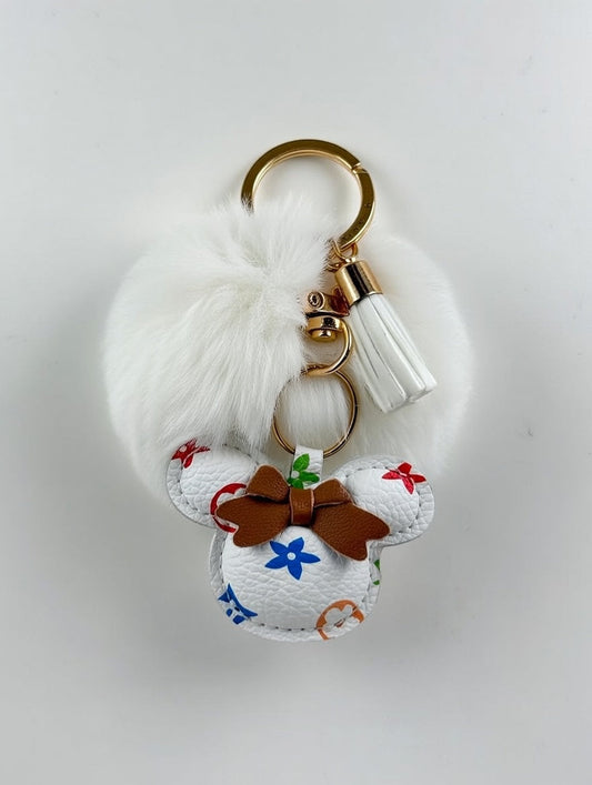 White fluffy pom-pom keyring with multicolour LV charm